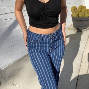 Stripped Denim Jeans with frayed bottoms